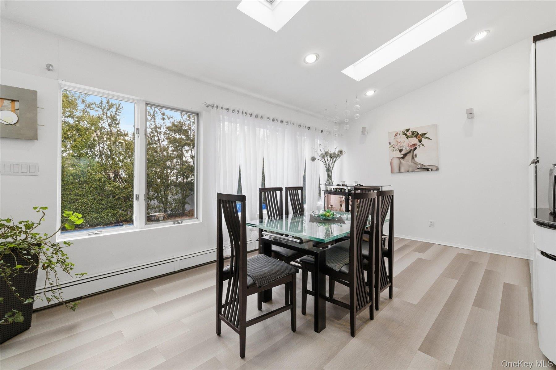 34 Reyam Road Lynbrook, NY 11563 - Photo 12 of 38 a view of a dining room with furniture and wooden floor