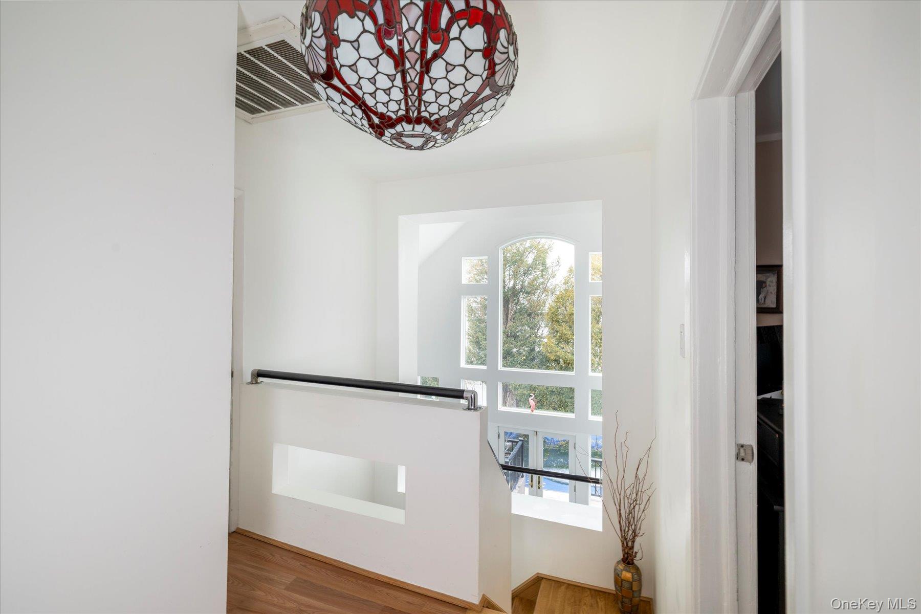 34 Reyam Road Lynbrook, NY 11563 - Photo 17 of 38 an empty room with wooden floor and a large window