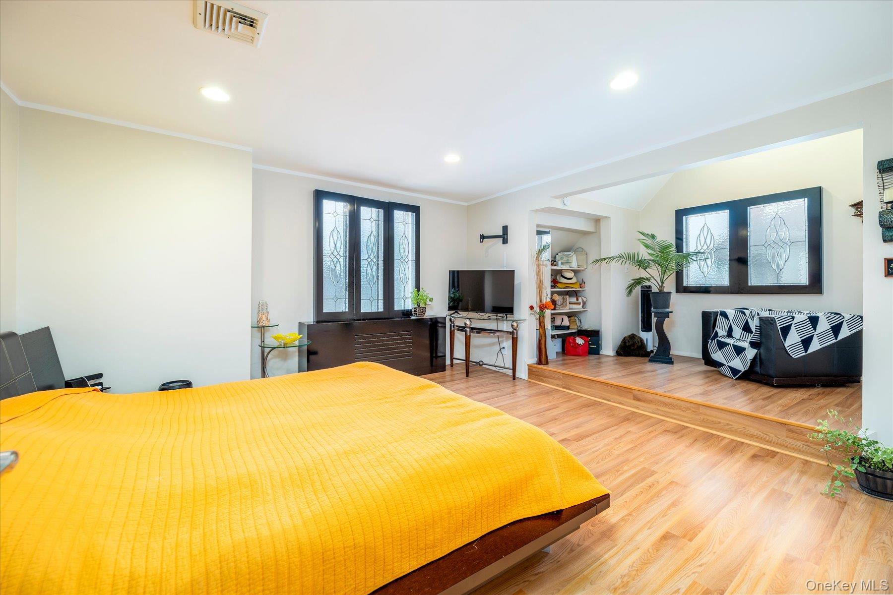 34 Reyam Road Lynbrook, NY 11563 - Photo 20 of 38 a bed room with a bed and a flat tv screen