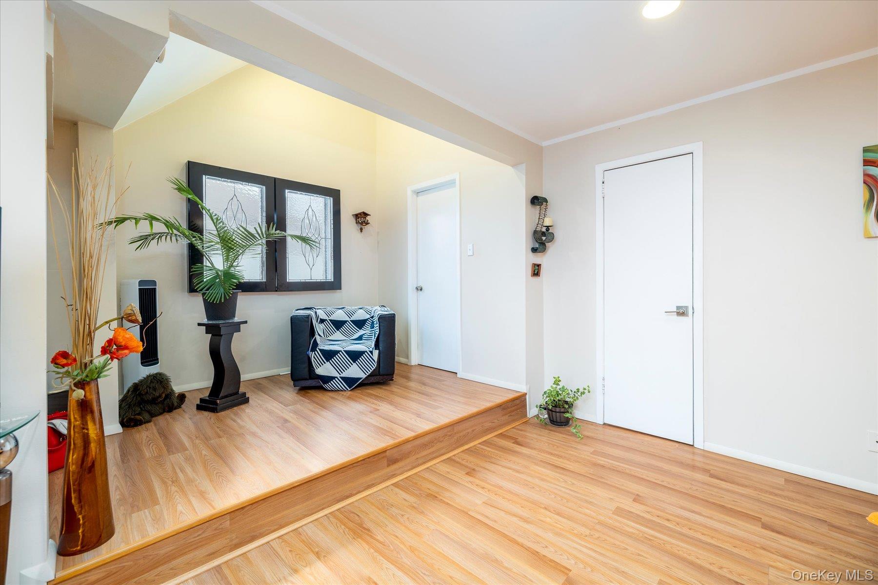 34 Reyam Road Lynbrook, NY 11563 - Photo 21 of 38 a bedroom with a bed and a dresser