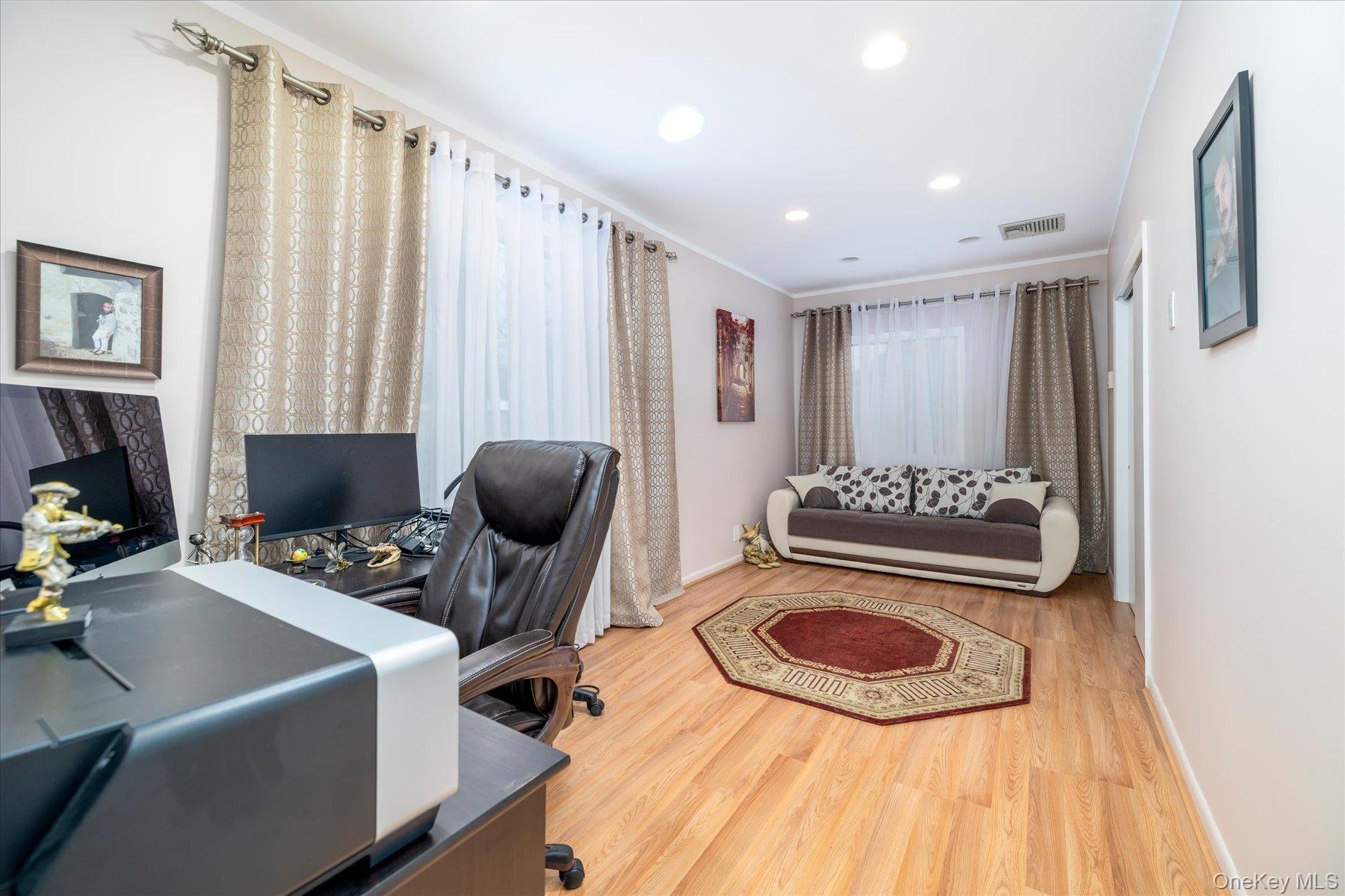 34 Reyam Road Lynbrook, NY 11563 - Photo 24 of 38 a bedroom with furniture and a rug