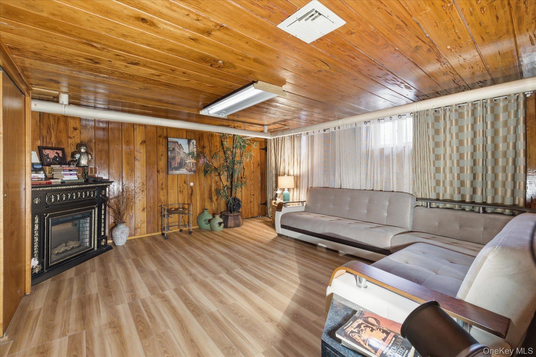34 Reyam Road Lynbrook, NY 11563 - Photo 25 of 38 a living room with furniture and wooden floor