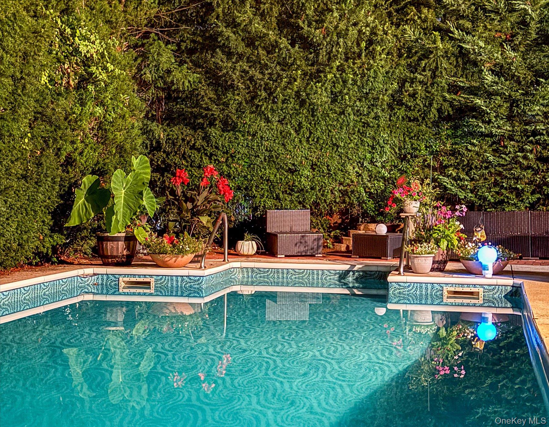 34 Reyam Road Lynbrook, NY 11563 - Photo 31 of 38 a backyard of a house with table and chairs plants and large trees