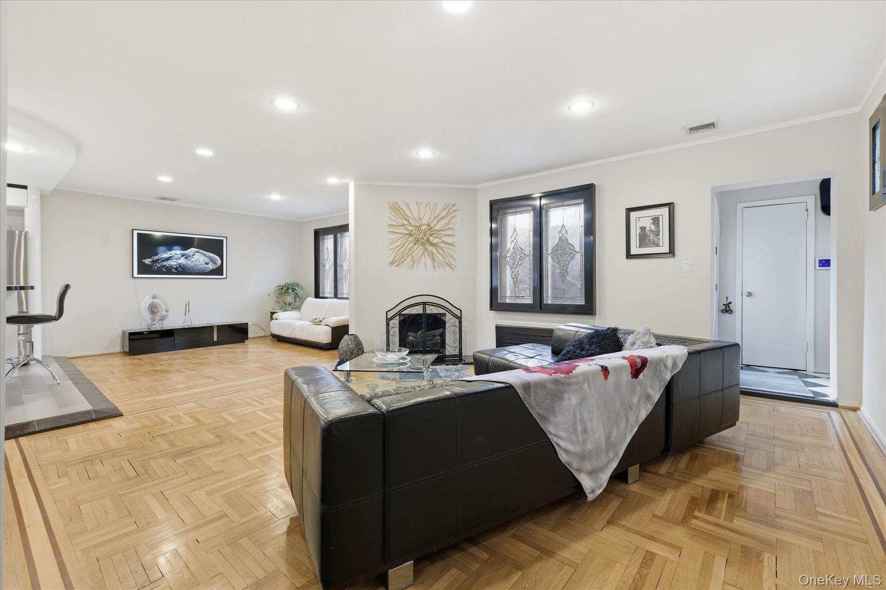 34 Reyam Road Lynbrook, NY 11563 - Photo 4 of 38 a living room with furniture and a flat screen tv