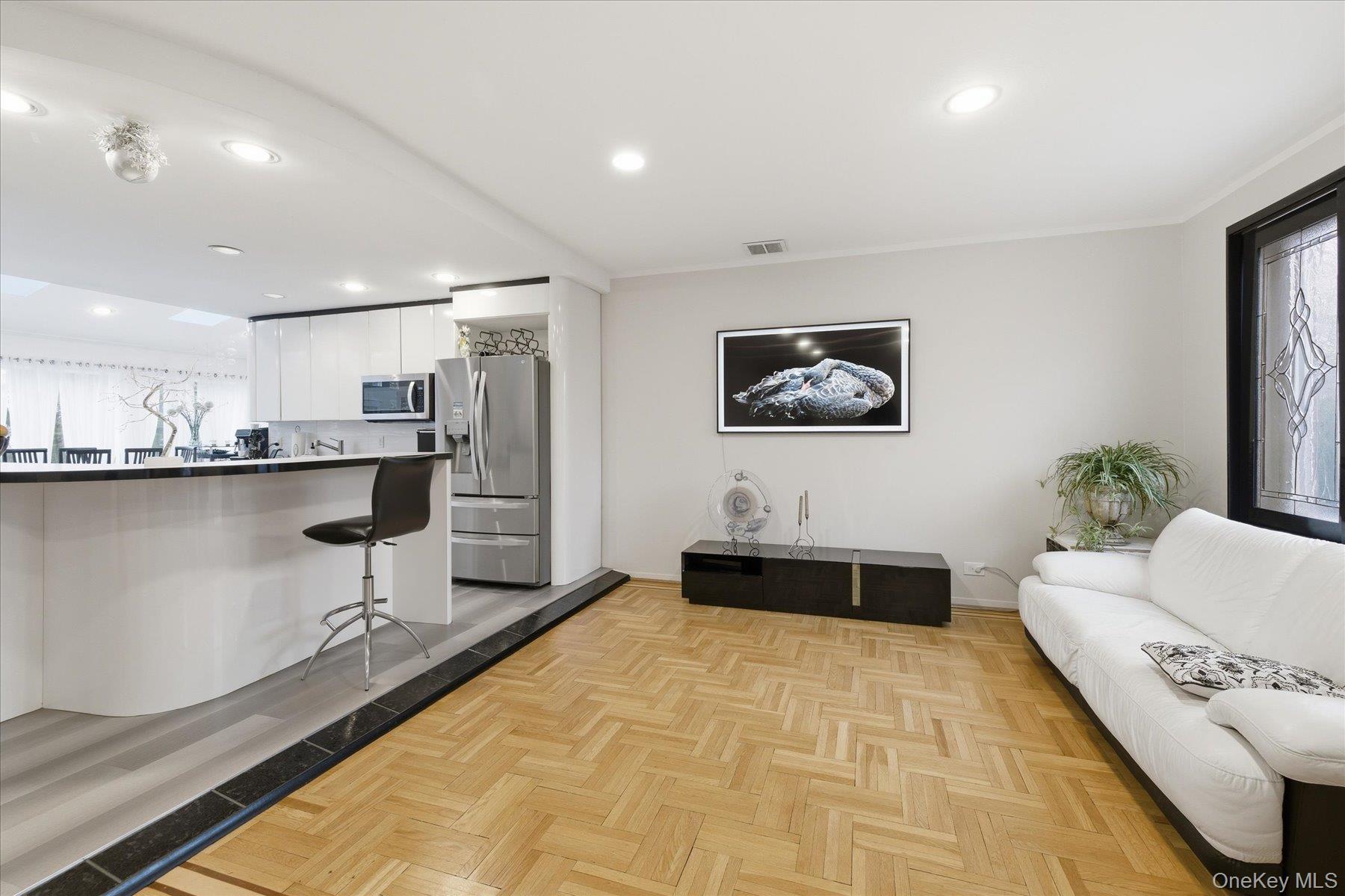 34 Reyam Road Lynbrook, NY 11563 - Photo 7 of 38 a living room with stainless steel appliances kitchen island granite countertop a sink and cabinets