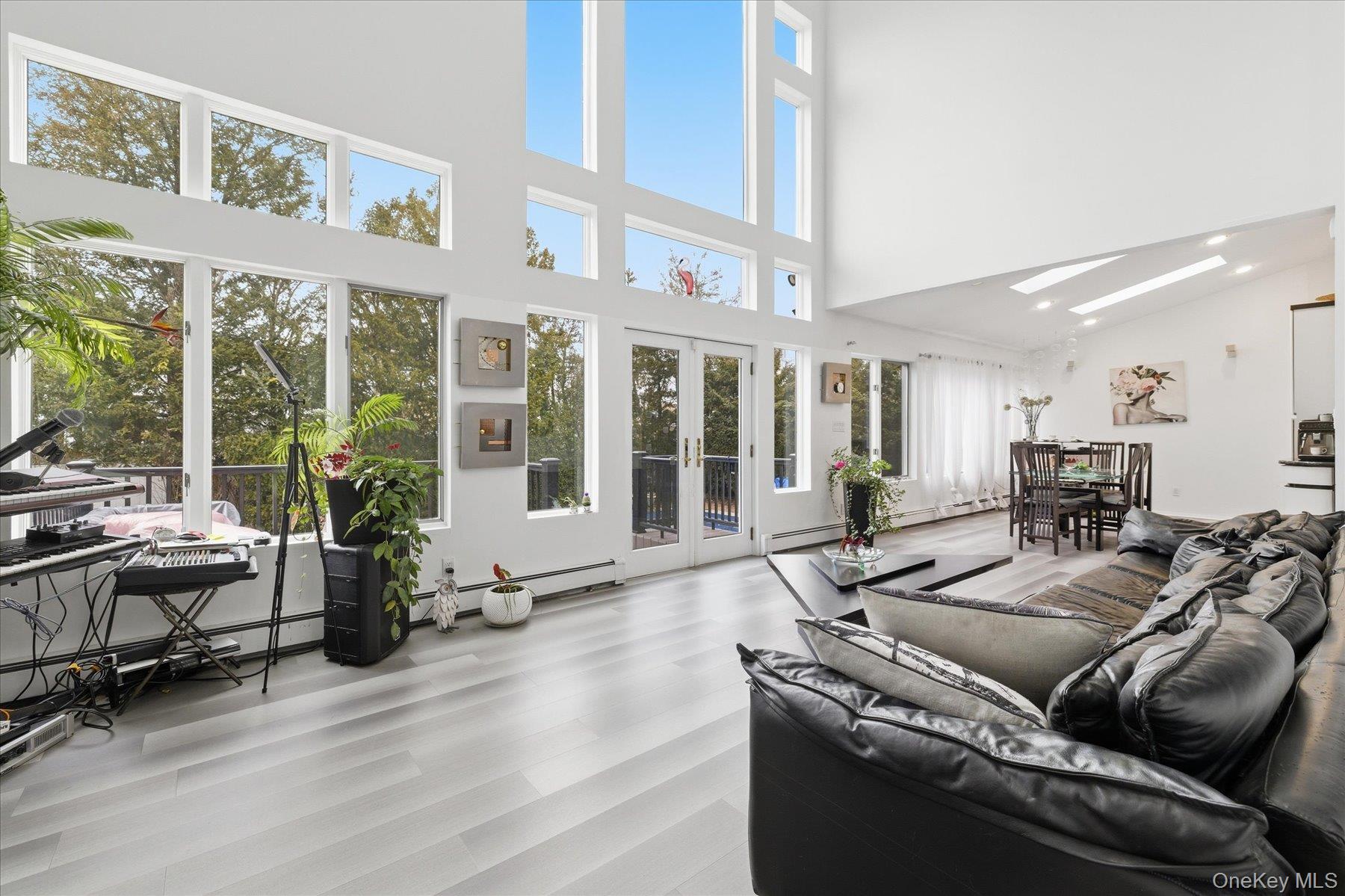 34 Reyam Road Lynbrook, NY 11563 - Photo 9 of 38 a living room with furniture and large windows