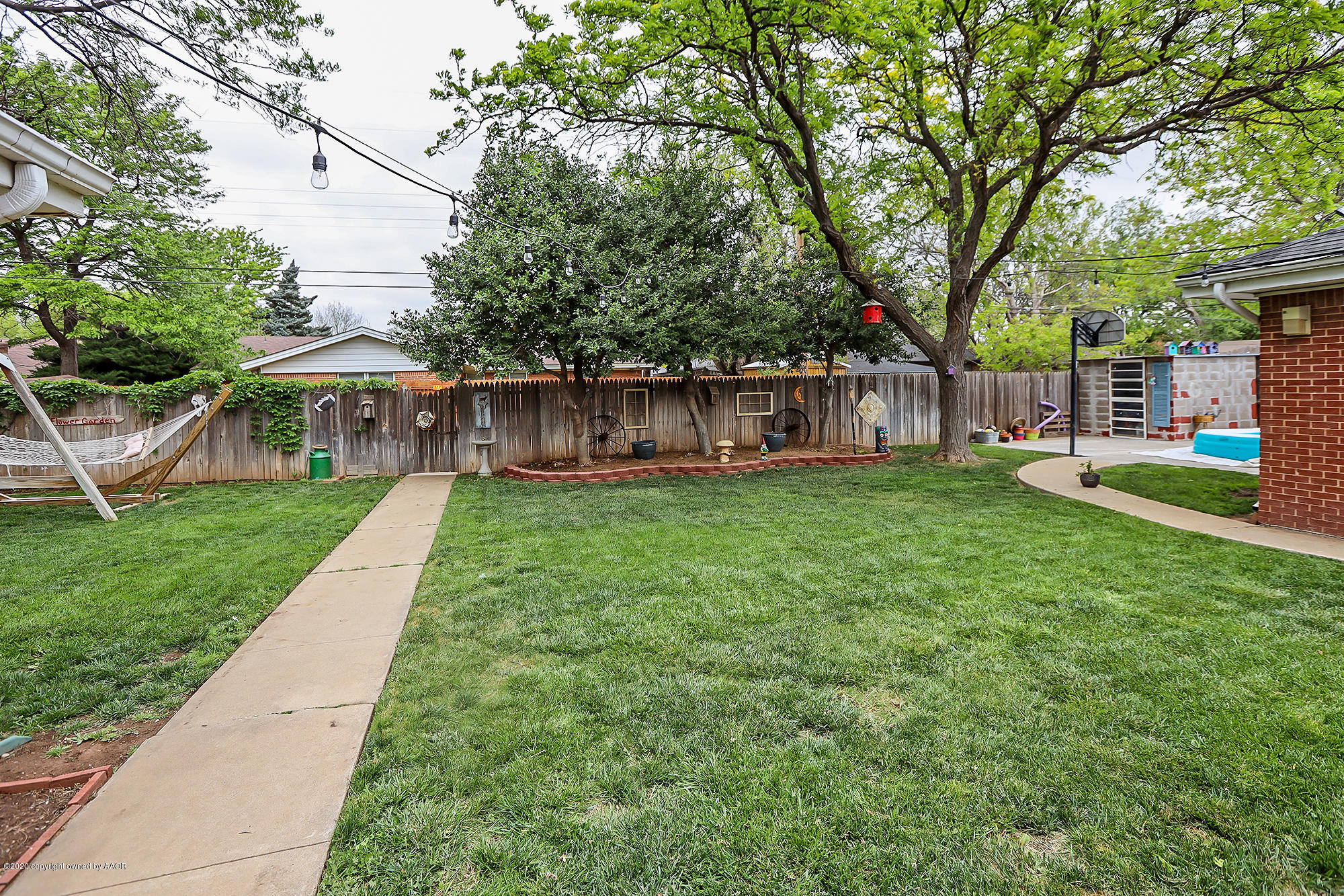 6018 Gainsborough Road Amarillo, TX 79106 - Photo 35 of 38 a view of a house with a yard and sitting area