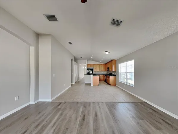 a view of a livingroom with a kitchen