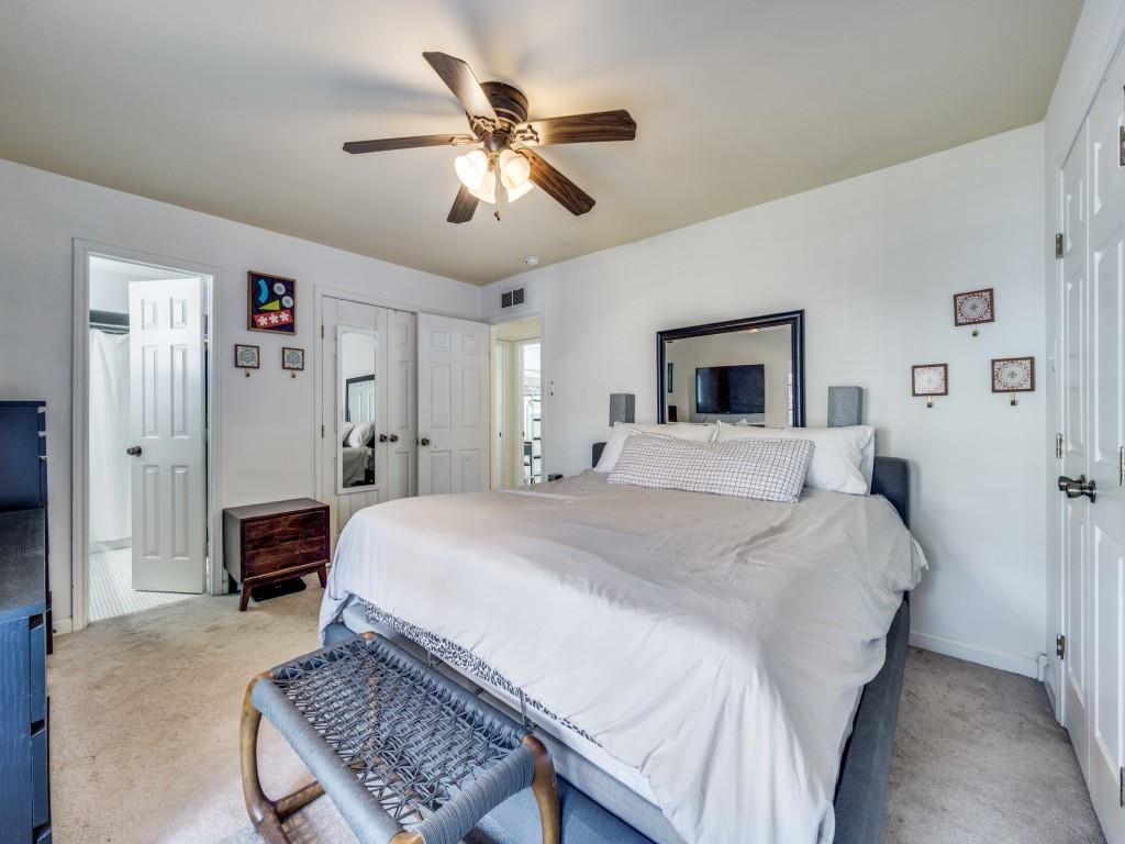 9835 Estate Lane Dallas, TX 75238 - Photo 17 of 25 Carpeted bedroom with a ceiling fan, ensuite bath, and a closet