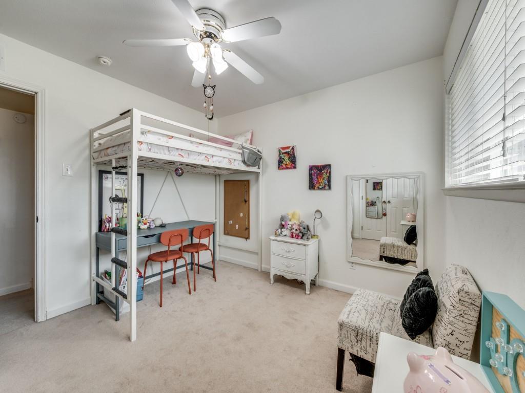 9835 Estate Lane Dallas, TX 75238 - Photo 21 of 25 Bedroom with light colored carpet and a ceiling fan