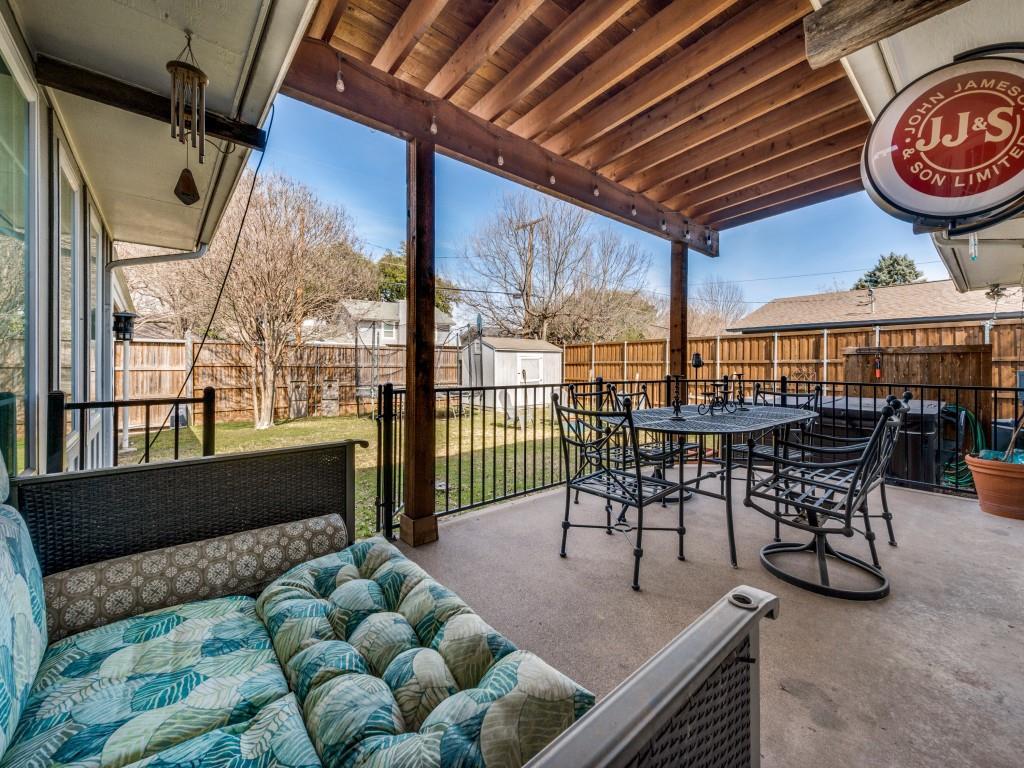 9835 Estate Lane Dallas, TX 75238 - Photo 23 of 25 Fenced backyard featuring outdoor dining space, a shed, and a patio area