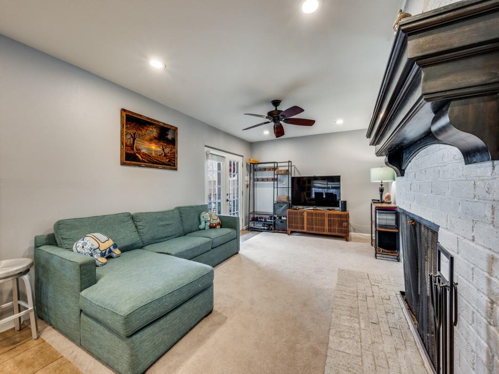 9835 Estate Lane Dallas, TX 75238 - Photo 6 of 25 Living room featuring a fireplace, ceiling fan, and recessed lighting