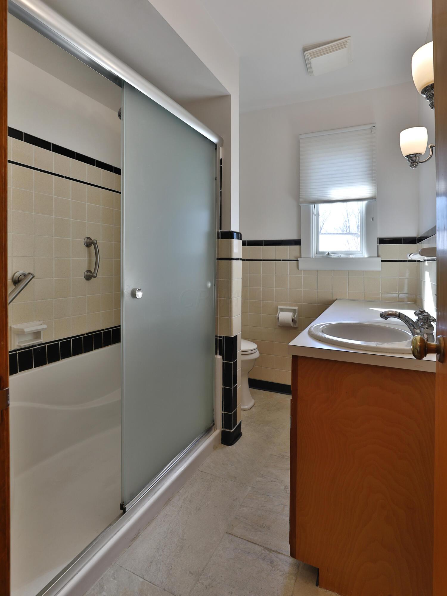 3231 Somerford Road Columbus, OH 43221 - Photo 19 of 35 Shower with Tile Backing and frosted door.