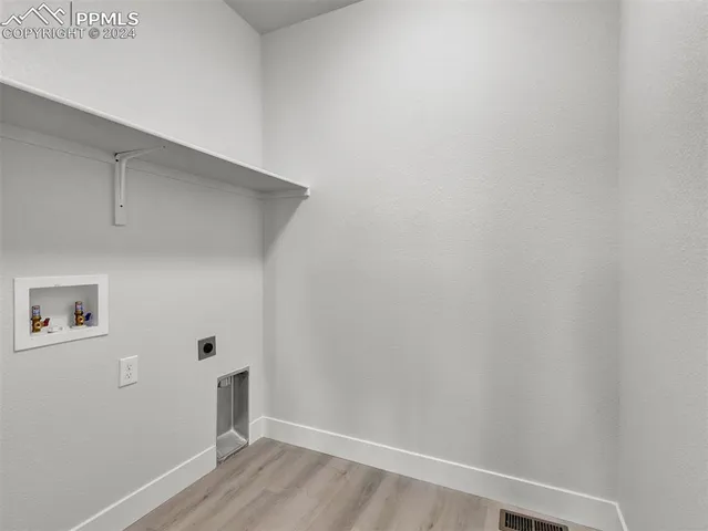 a view of small space with wooden floor