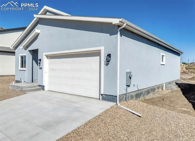 a view of a house with a garage