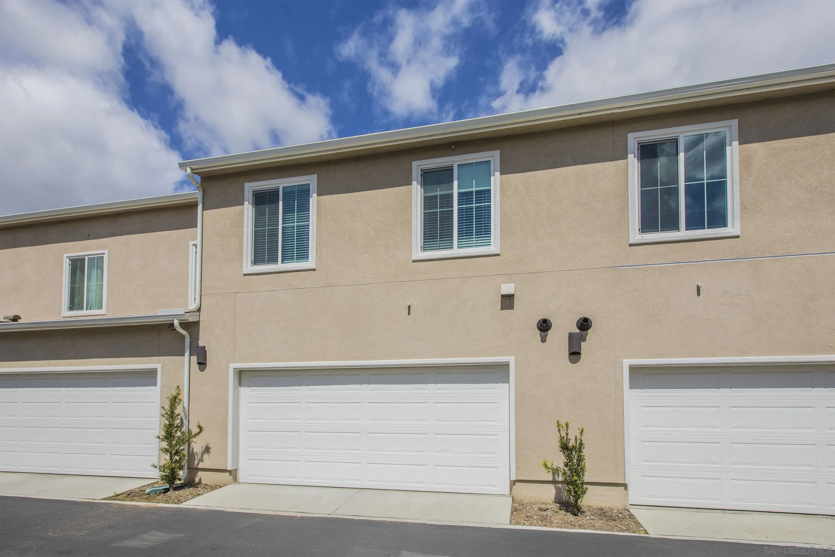 356 Sweet Place Fallbrook, CA 92028 - Photo 11 of 12 a front view of a house with a yard and garage