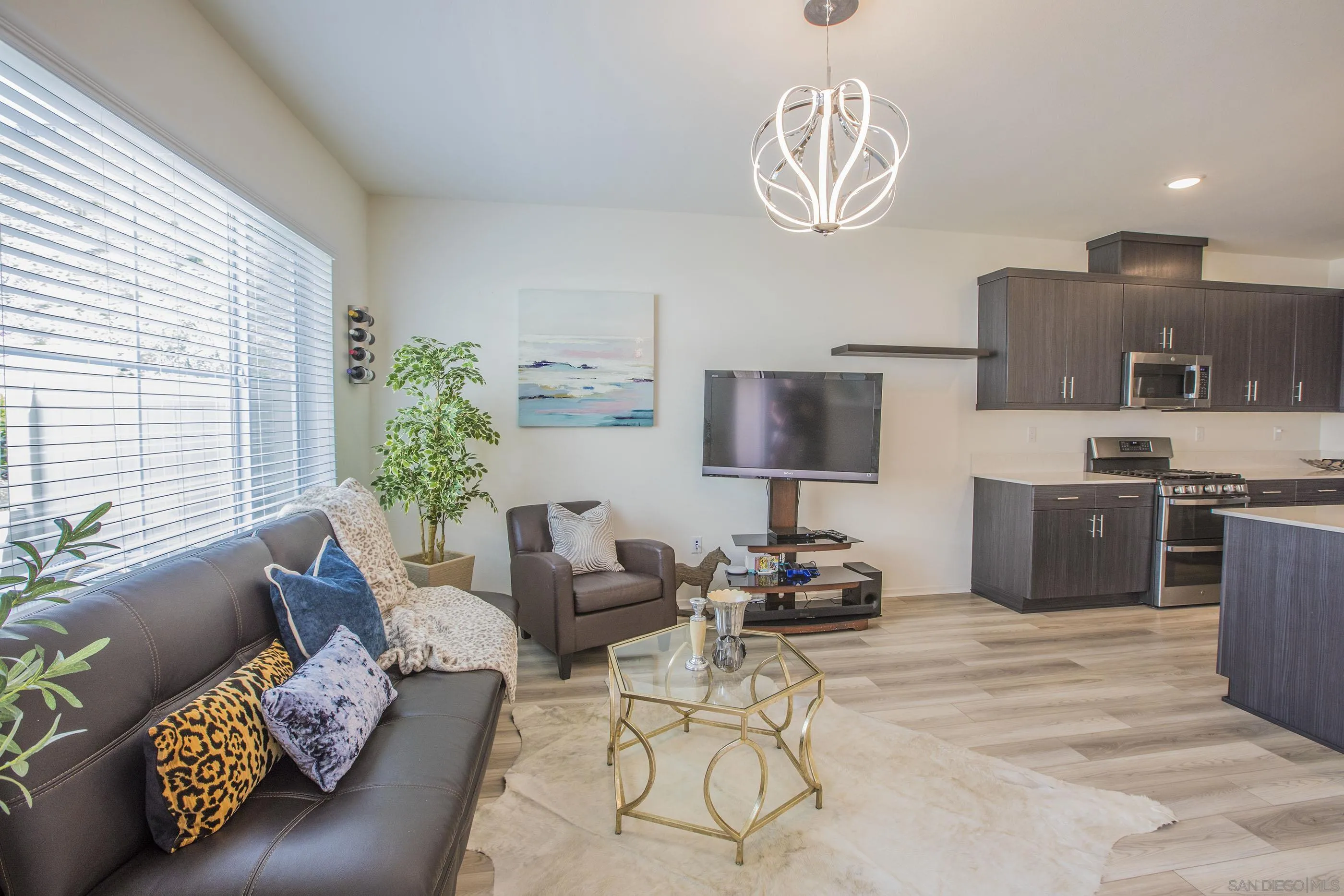 356 Sweet Place Fallbrook, CA 92028 - Photo 3 of 12 a living room with furniture and a flat screen tv