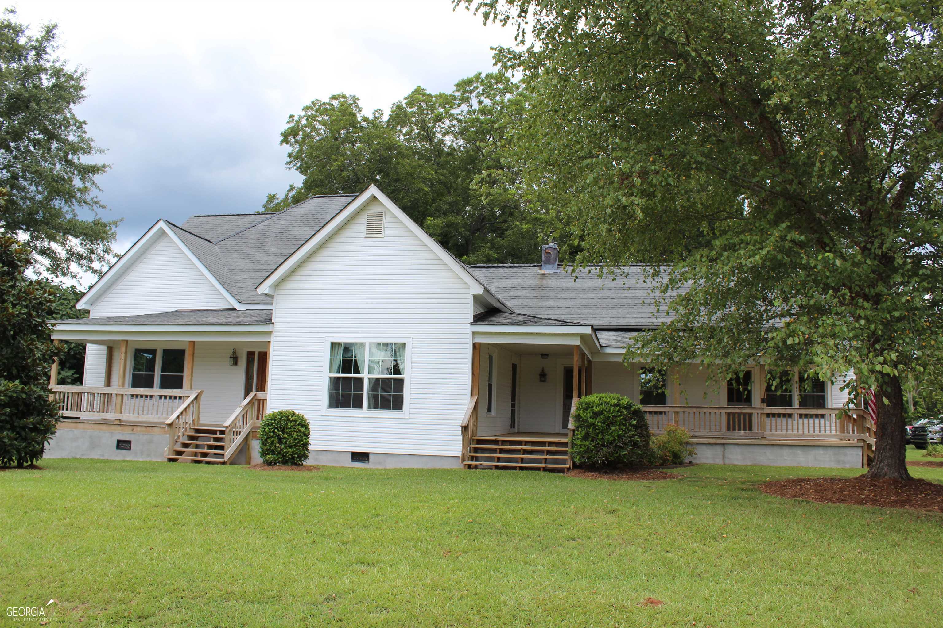 495 Rehoboth Church Road Griffin, GA 30224 - Photo 1 of 1 a front view of a house with a garden