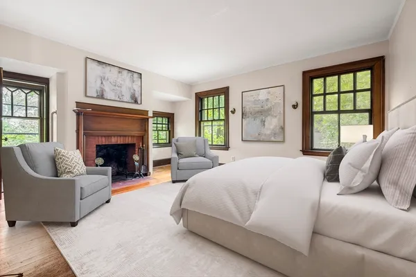 a bedroom with a large bed and a couch