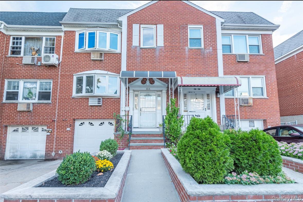 18-16 Bell Boulevard, Unit 2 Queens, NY 11360 - Photo 1 of 8 a front view of a multi story building with yard