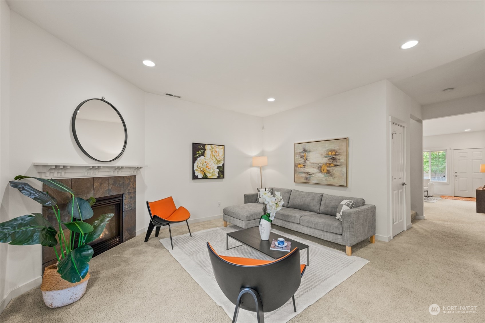 4119 240 Place Southeast Bothell, WA 98021 - Photo 5 of 32 a living room with furniture a rug and a fireplace
