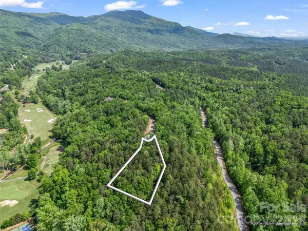 a view of a backyard of the house