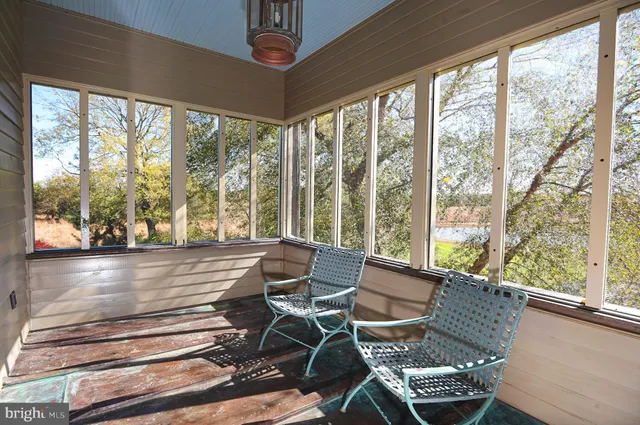 a view of a garden with an outdoor seating