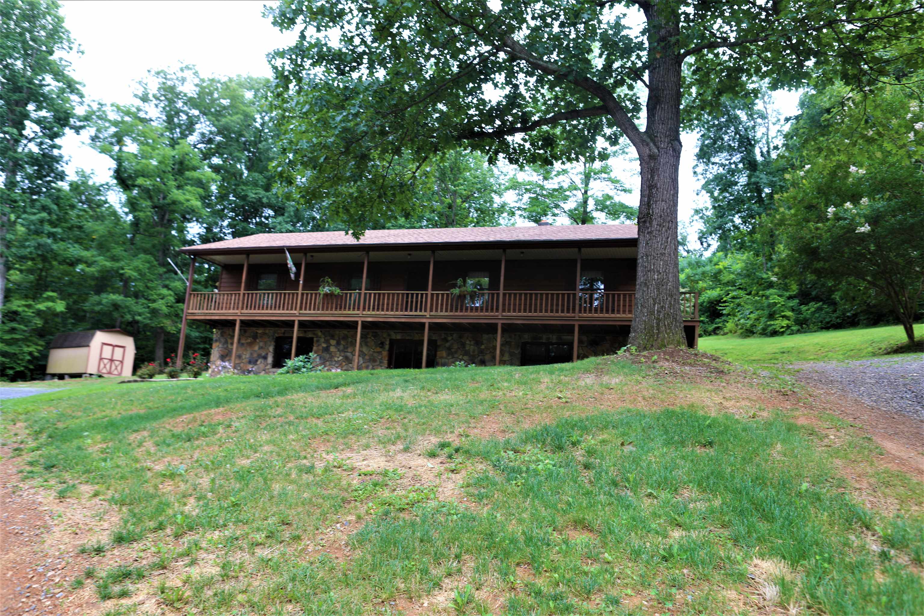 573 Round Hill School Road Fort Defiance, VA 24437 - Photo 22 of 65 a front view of a house with a garden