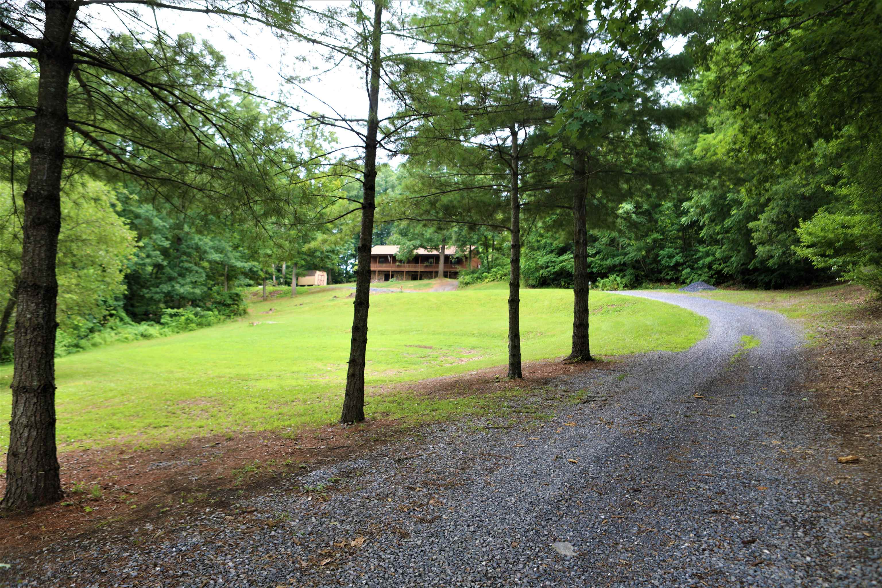 573 Round Hill School Road Fort Defiance, VA 24437 - Photo 23 of 65 a view of a yard with a tree