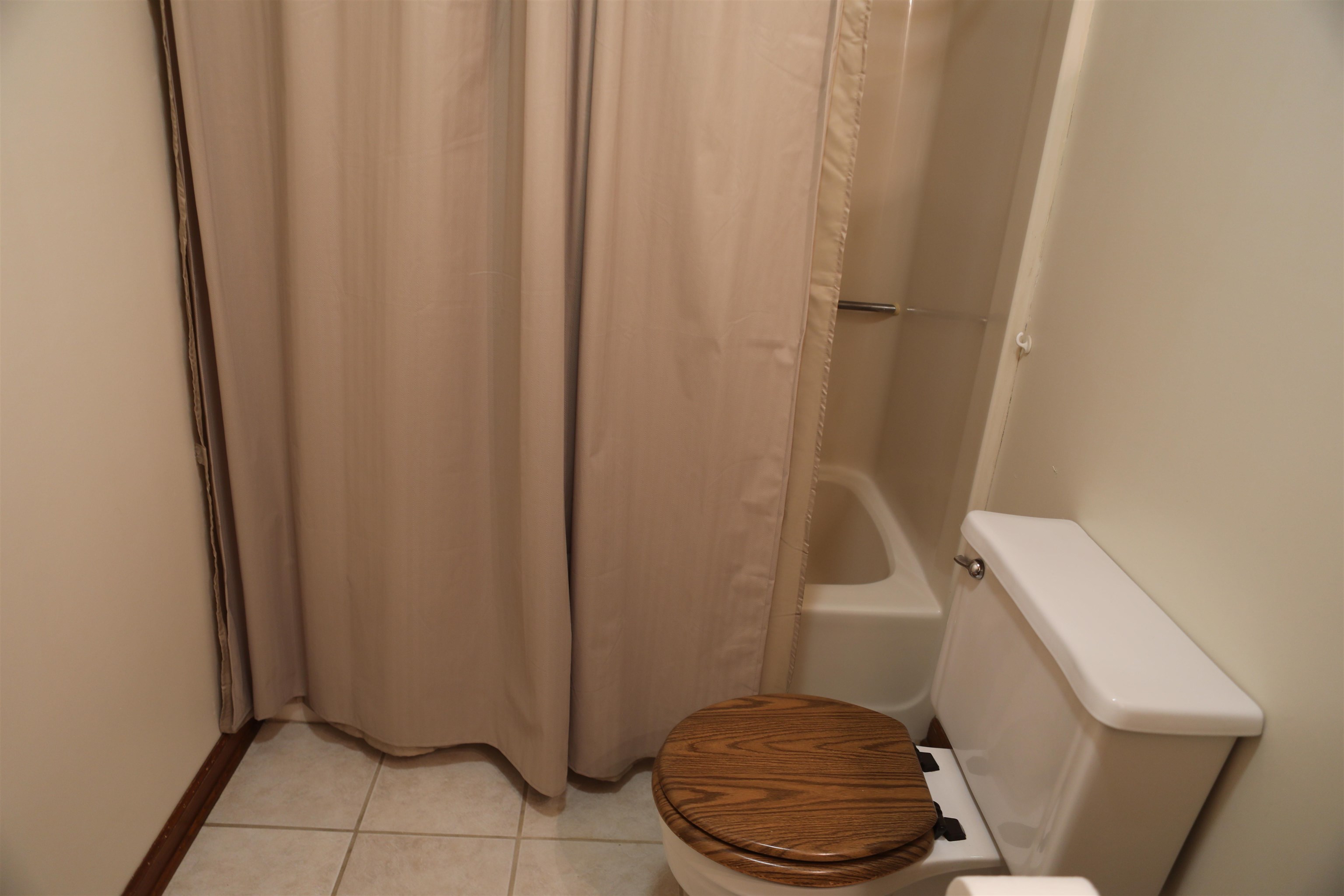 573 Round Hill School Road Fort Defiance, VA 24437 - Photo 62 of 65 a bathroom with a sink and a toilet