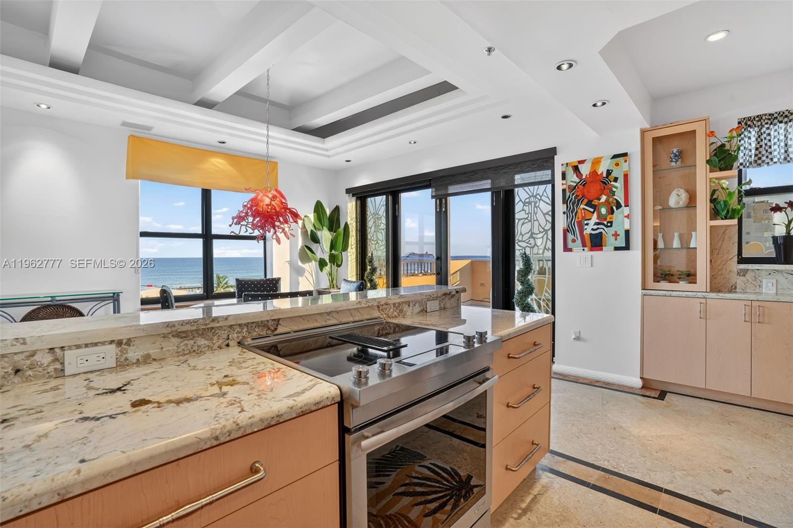 1330 Ocean Drive, Unit R7C Miami Beach, FL 33139 - Photo 9 of 21 a kitchen with stainless steel appliances granite countertop a stove and a sink
