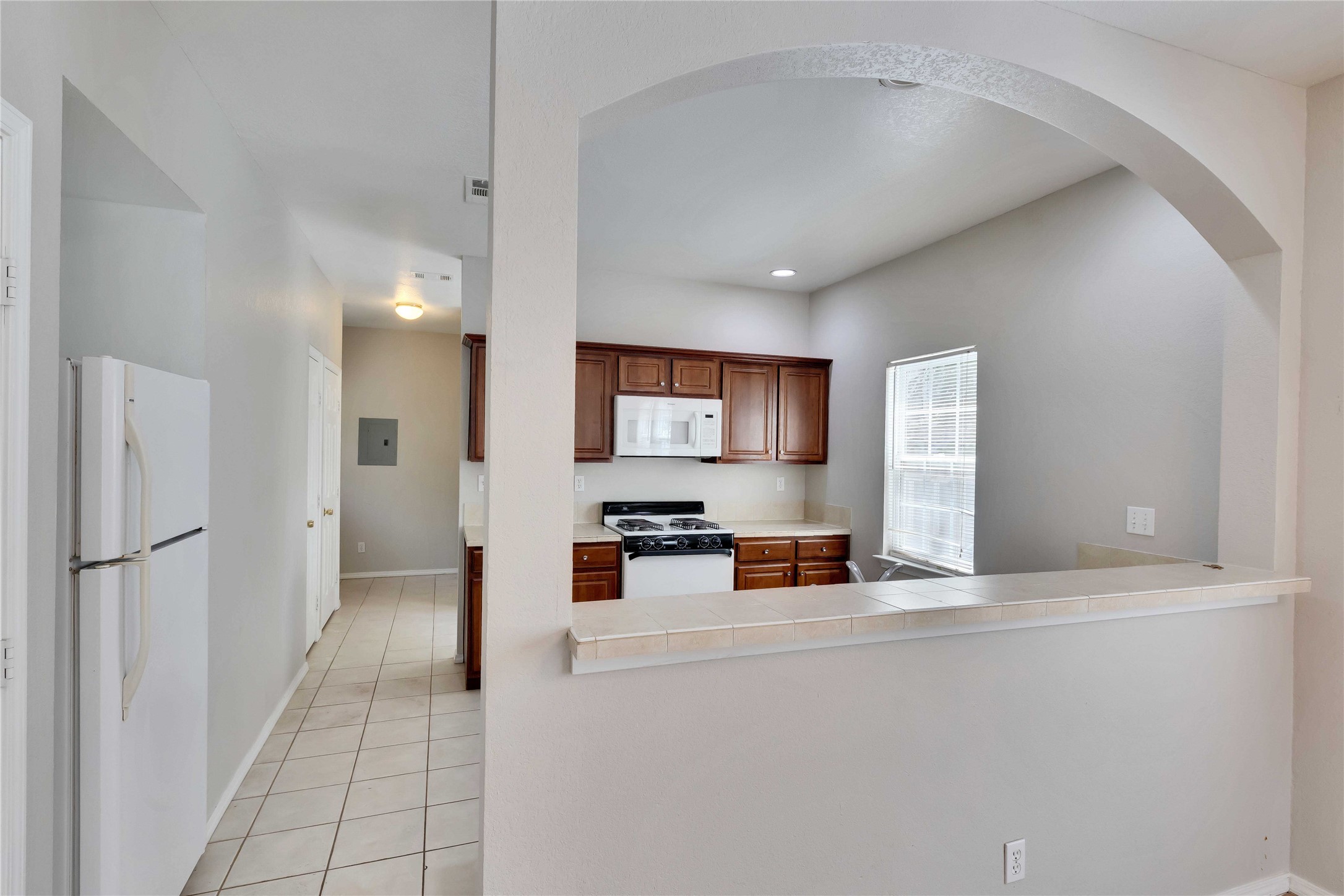 2201 East 18th Street, Unit B Austin, TX 78702 - Photo 4 of 25 A well-equipped kitchen offers ample cabinet space and a practical layout for daily meal preparation.