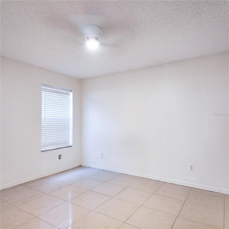 5152 Conroy Road, Unit 1317 Orlando, FL 32811 - Photo 12 of 21 an empty room with a window