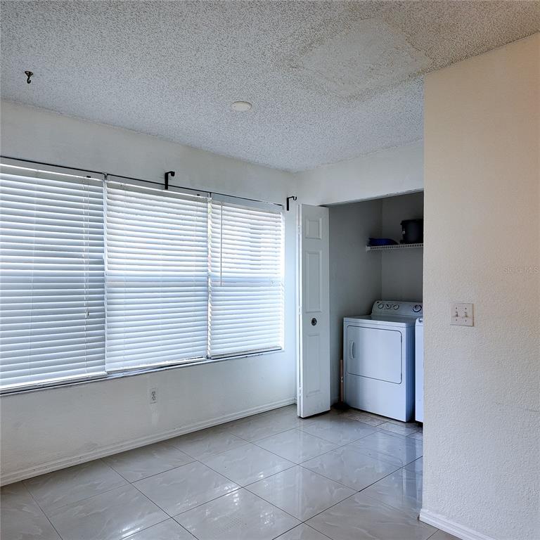 5152 Conroy Road, Unit 1317 Orlando, FL 32811 - Photo 20 of 21 a view of an empty room with a window