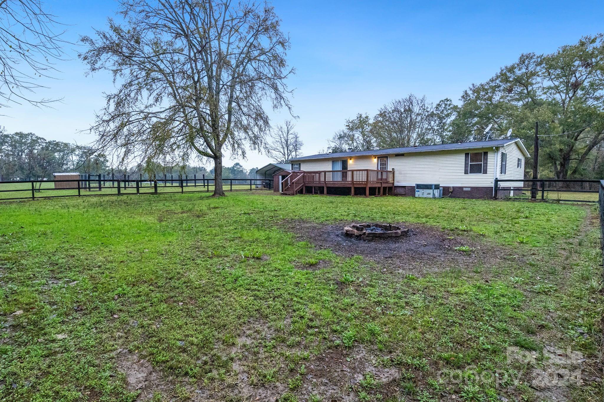 2174 Gregg Road Rock Hill, SC 29730 - Photo 8 of 36 a view of a backyard with large trees