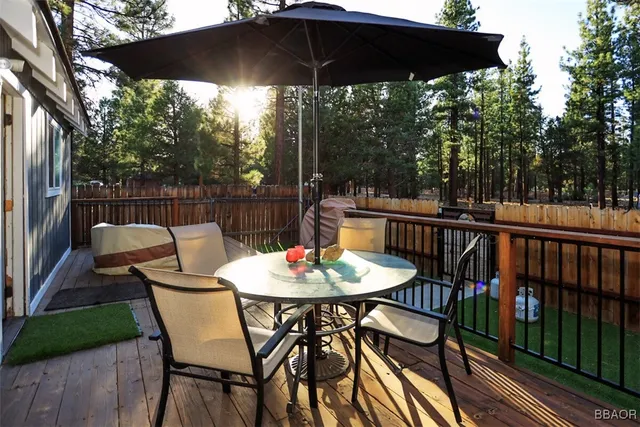 a view of a chairs and table in the balcony