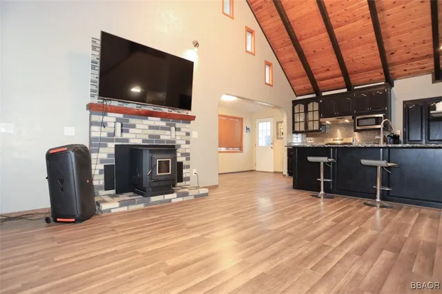 a kitchen with stainless steel appliances granite countertop a stove refrigerator sink and cabinets