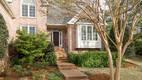 front view of a house with a garden