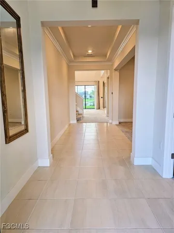 a spacious bedroom with a bed and glass windows