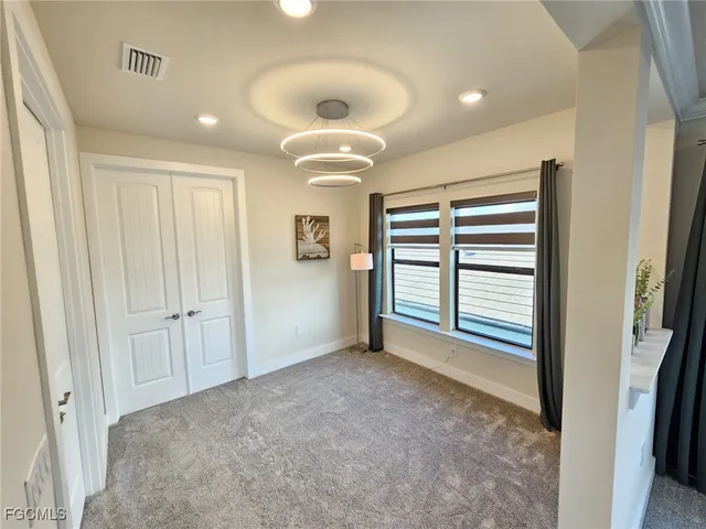 a spacious bathroom with a double vanity sink mirror and bathtub