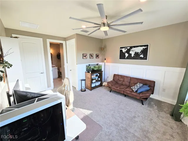 a bedroom with furniture and a window