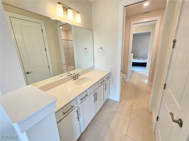 a bathroom with a shower and a bath tub