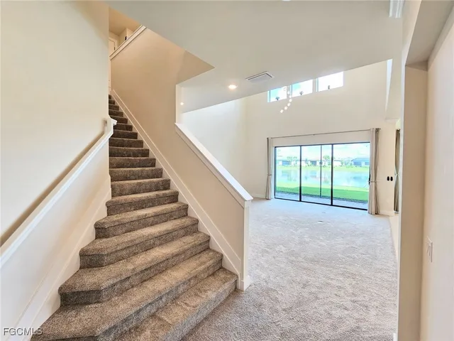 a view of hallway with wooden floor