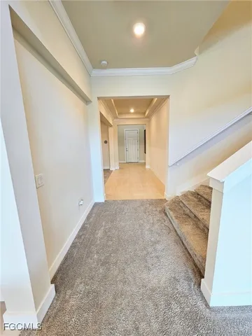 a view of a hallway with a window