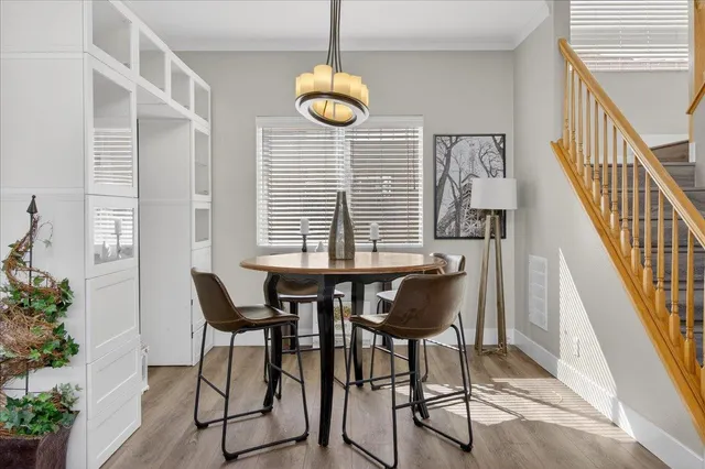 a view of a dining room with furniture window and wooden floor