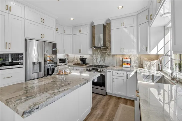 a spacious bedroom with a bed and a table