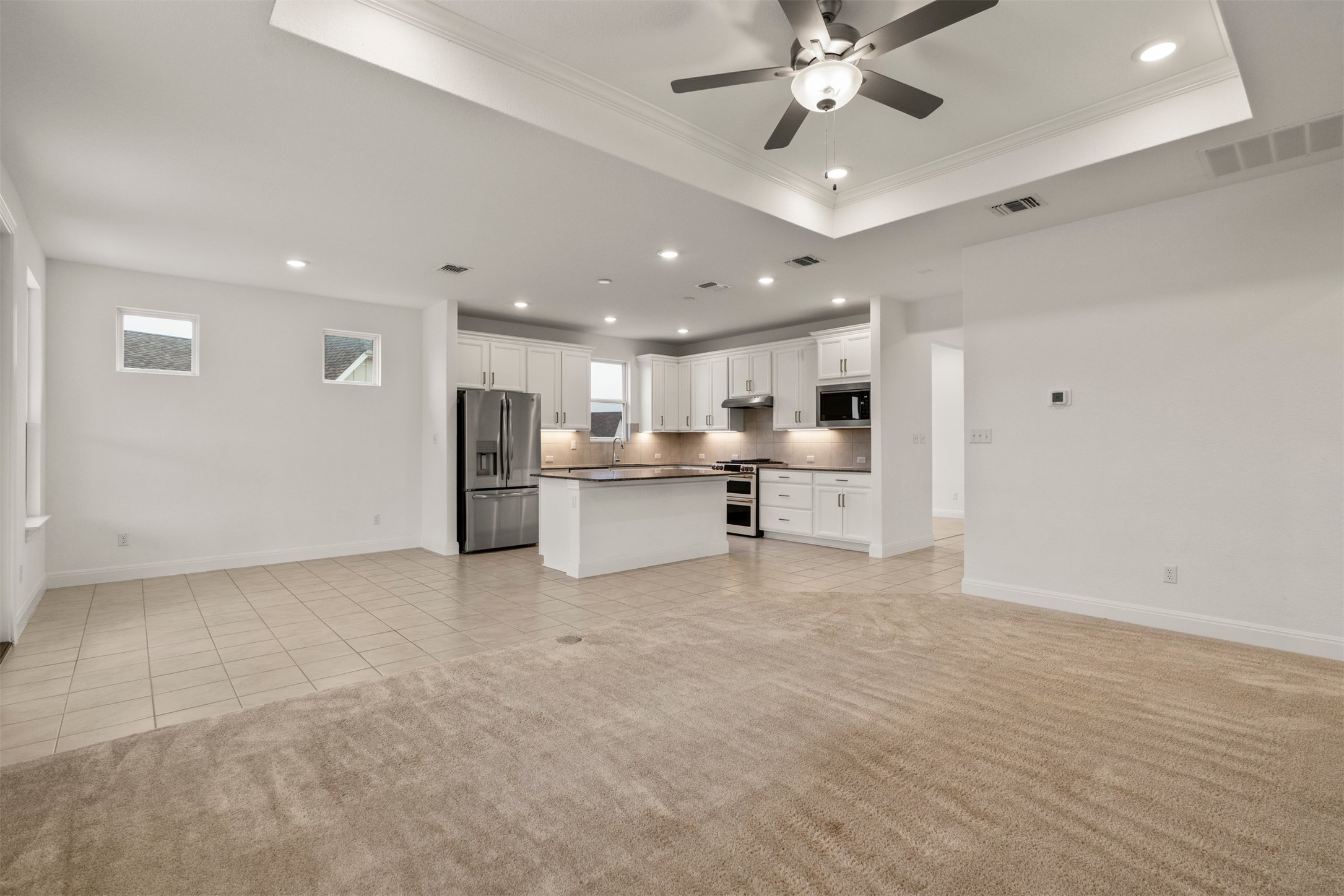 302 Barn Hill Loop Dripping Springs, TX 78620 - Photo 11 of 40 The kitchen sits at the center of the home, open to the living and dining areas, making it easy to stay connected while cooking, hosting, or moving through the space