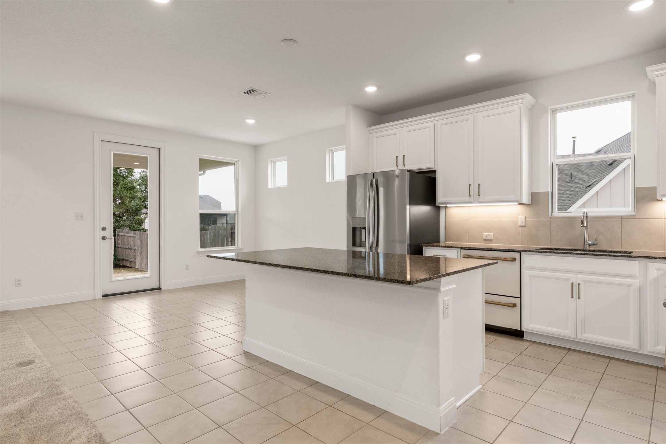 302 Barn Hill Loop Dripping Springs, TX 78620 - Photo 15 of 40 Cabinetry provides ample storage for cookware, pantry items, and everyday essentials, keeping counters usable and uncluttered