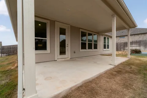 a view of a swimming pool with outdoor seating
