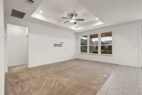 a view of kitchen with refrigerator and window